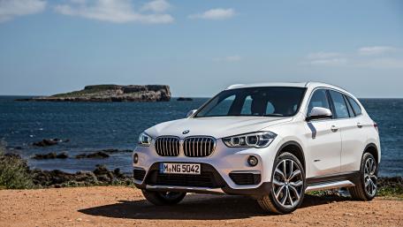Sleek Luxury SUV by the Seaside wallpaper