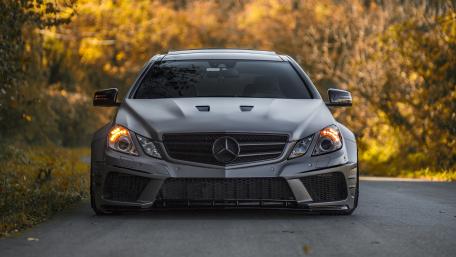 Sleek and Powerful Mercedes on a Scenic Roadway wallpaper
