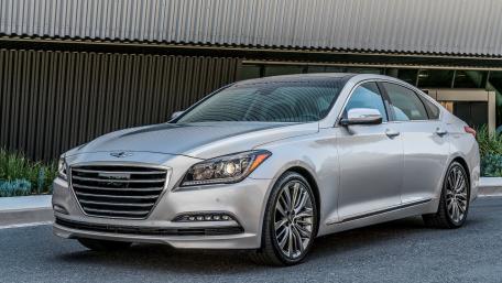 Sleek Silver Sedan in Urban Setting wallpaper