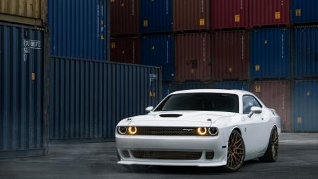 Sleek White Muscle Car in Urban Setting wallpaper