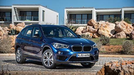 Sleek BMW SUV in Vibrant Landscape wallpaper