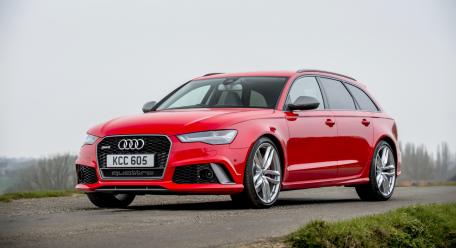 Sleek Red Audi RS6 Avant on a Scenic Road wallpaper