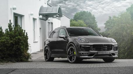 Sleek Luxury SUV Captured in an Urban Setting wallpaper