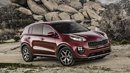 Stylish Red SUV in Nature's Embrace wallpaper