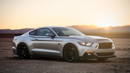 Sleek Silver Mustang Under a Golden Sunset wallpaper