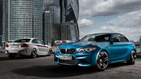 Sleek BMW Performance in Modern Urban Setting wallpaper