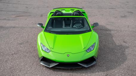 Vibrant Green Lamborghini with Open Roof Features wallpaper