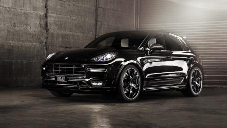 Sleek Black SUV in Urban Setting wallpaper