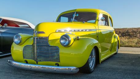 Vibrant Classic Car in Stunning Yellow Finish wallpaper