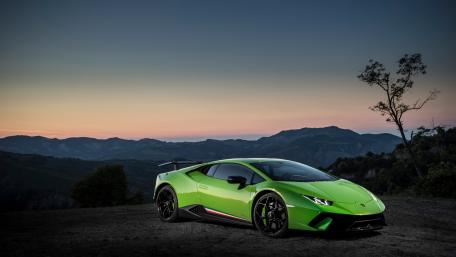 Stunning Lamborghini Huracan in Vibrant Green Under Sunset Sky wallpaper