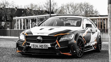 Sleek Black and Orange Sports Car Wallpaper wallpaper