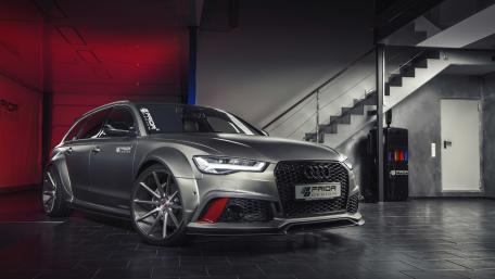 Sleek Audi RS6 in Modern Showroom Ambience wallpaper