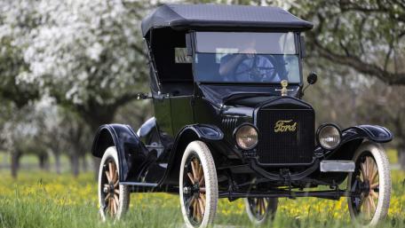 Vintage Ford Model T in Scenic Spring Landscape wallpaper