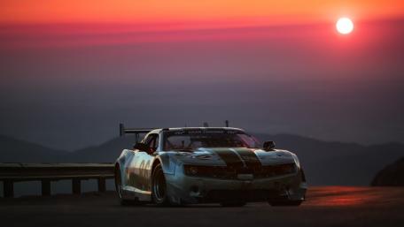 Sunset Glory of a Racing Car wallpaper