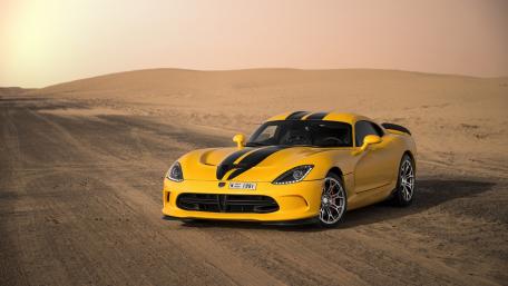 Stunning Yellow Sports Car on Desert Terrain wallpaper