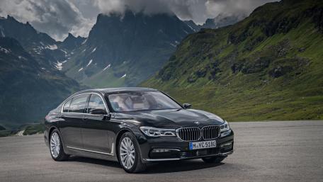 Elegant BMW on a Scenic Mountain Road wallpaper