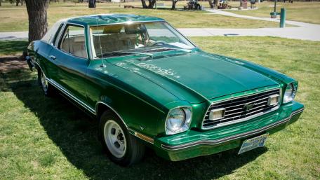 Classic Green Ford Car in a Park Setting wallpaper