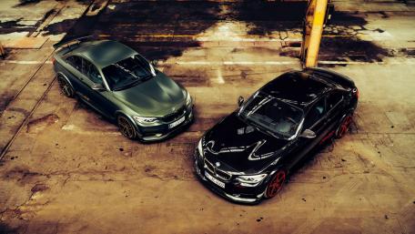 Sleek Luxury Cars in Urban Setting wallpaper