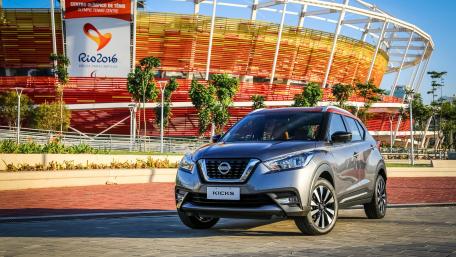 Sleek Nissan Kicks in Vibrant Olympic Stadium Background wallpaper