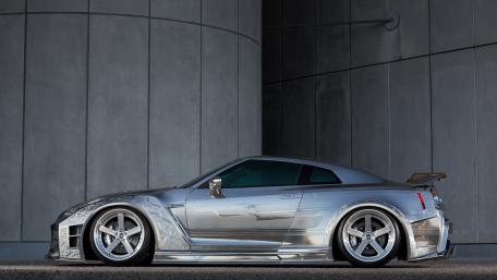 Sleek Silver Supercar in Urban Setting wallpaper