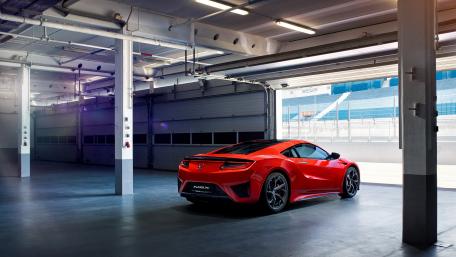 Sleek Red NSX in Modern Garage Space wallpaper