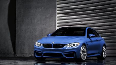 Sleek Blue BMW M4 in Urban Setting wallpaper
