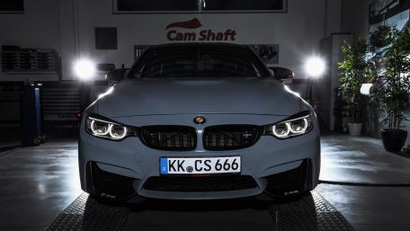 Sleek BMW Under Studio Lights wallpaper