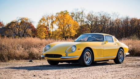 Classic Yellow Sports Car in Autumn Landscape wallpaper