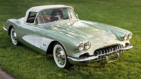 Classic 1950s Convertible Car on Green Grass wallpaper