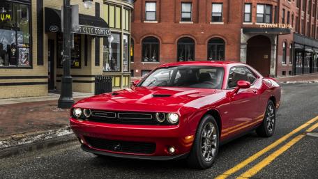 Classic Red Muscle Car on Urban Street Scene wallpaper