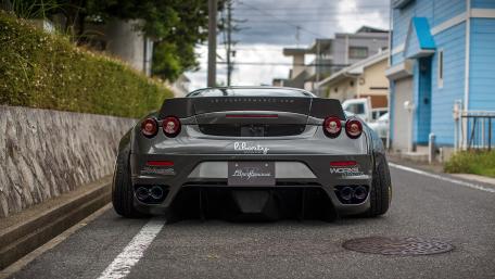 Sleek Gray Sports Car in Urban Setting wallpaper