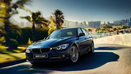 Sleek BMW 3 Series in Urban Paradise wallpaper