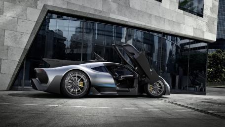 Sleek Silver Supercar in Urban Setting wallpaper
