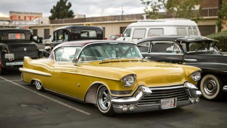 Classic Yellow Cadillac on Display at Vintage Car Show wallpaper