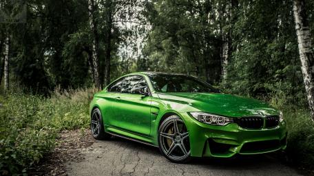 Vibrant Green BMW M4 in Nature Scene wallpaper