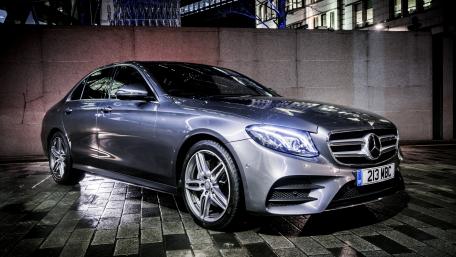 Sleek Luxury Car in Urban Setting wallpaper