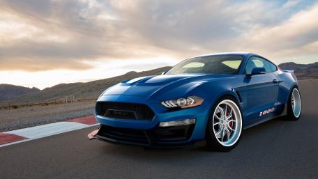 Sleek Blue Shelby Mustang in a Scenic Landscape wallpaper