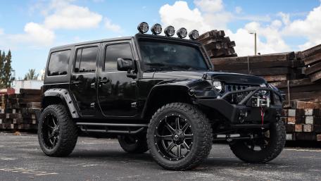 Bold Black Jeep Wrangler with Off-Road Style wallpaper