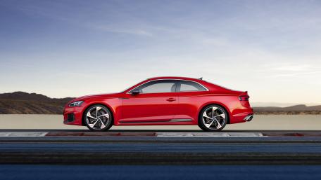 Sleek Red Coupe on a Racing Track wallpaper