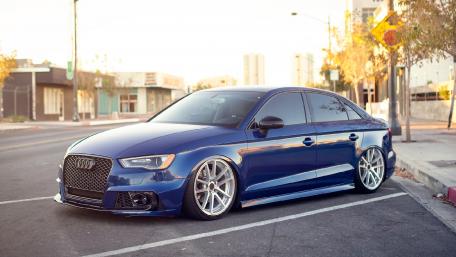 Sleek Blue Audi in Urban Setting wallpaper