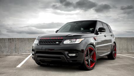 Sleek Black SUV in Urban Setting wallpaper