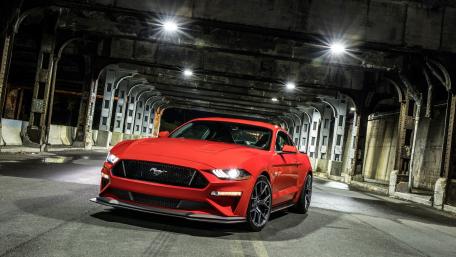 Red Mustang Under Urban Lights wallpaper