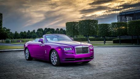 Vibrant Luxury Convertible on Scenic Drive wallpaper