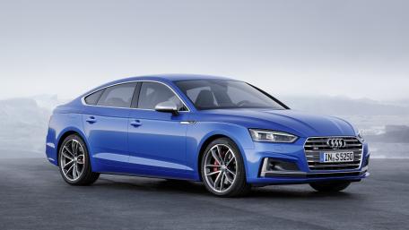 Sleek Blue Audi in Nature's Embrace wallpaper