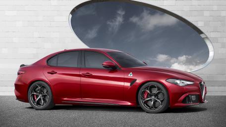 Sleek and Striking Red Sedan Wallpaper wallpaper