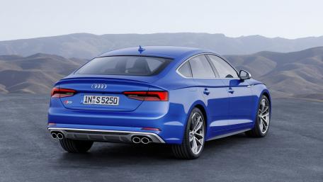 Sleek Blue Audi in Scenic Landscape wallpaper