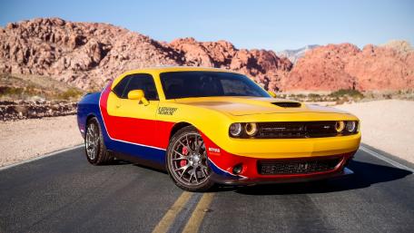 Vibrant Muscle Car Against Desert Landscape wallpaper