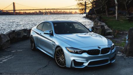 Sleek BMW M4 by the Water at Sunset wallpaper