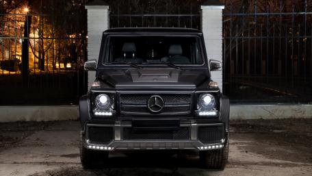 Sleek Black Mercedes G-Class in Urban Setting wallpaper