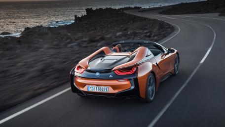 Sleek Orange BMW i8 Convertible on Coastal Road wallpaper